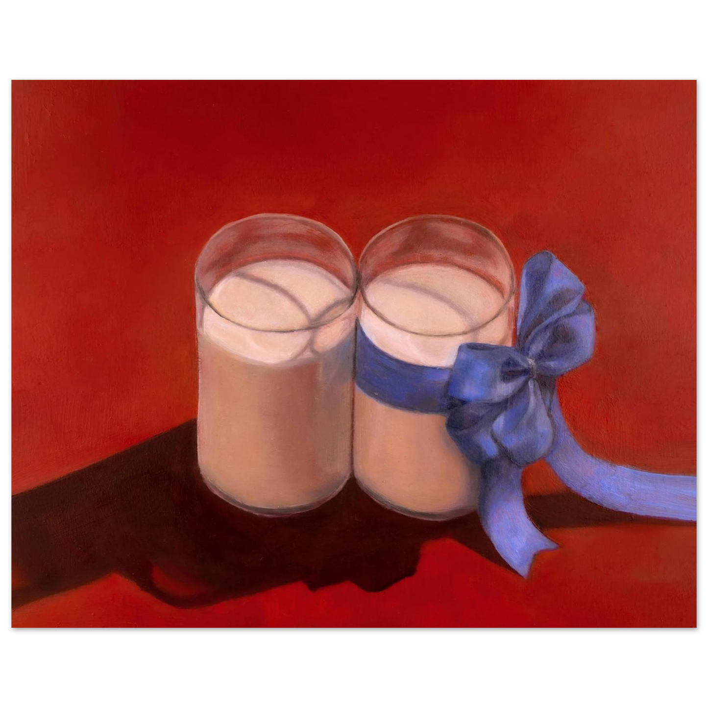 Jay Didyk's "Happy Holidays" painting of two glasses of milk against a vibrant red-orange background. The glass on the right has a large pastel blue bow tied around it. The shadows casted by the milk glasses appear as a handgun against the surface.